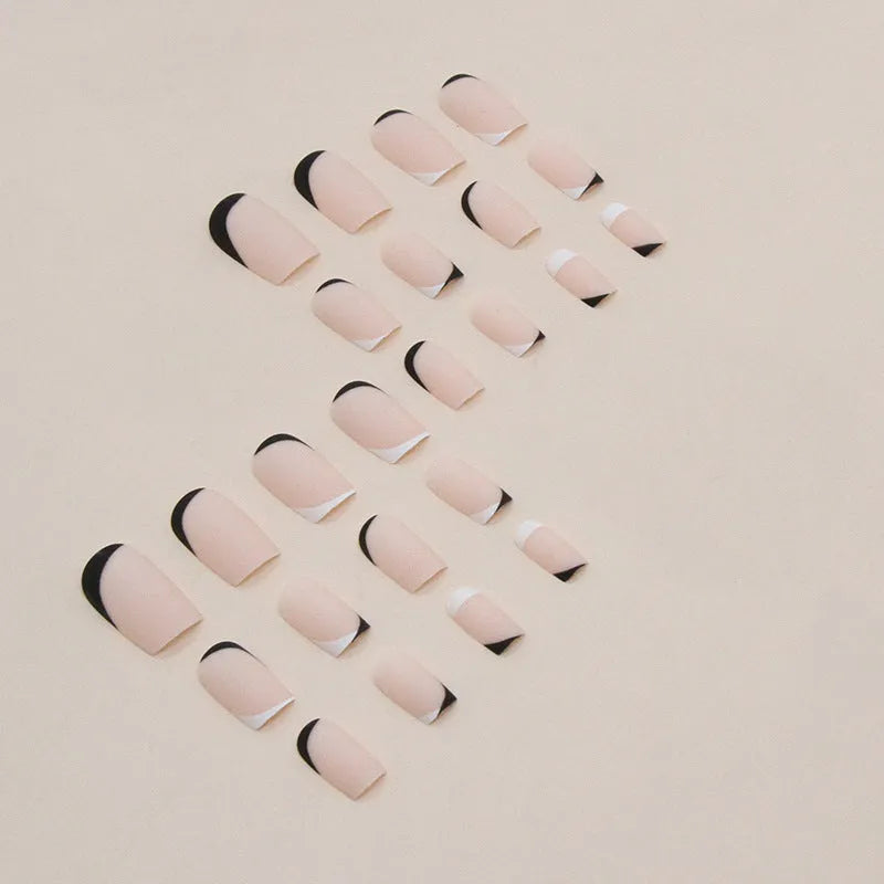 Black and white frosted artificial nails with mandarin duck colour design for French manicure