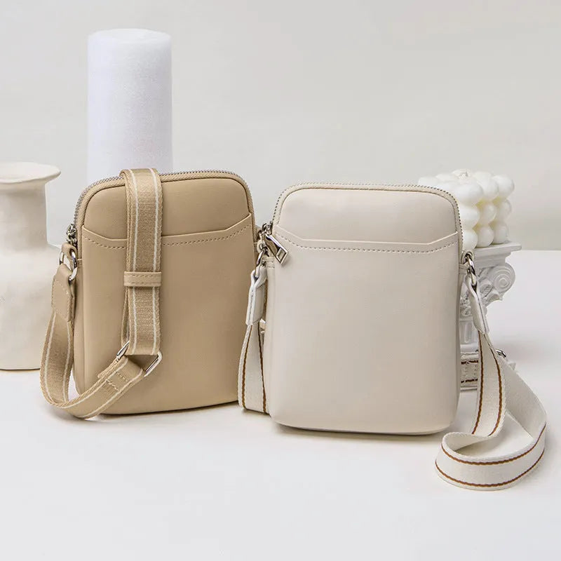 Small solid colour PU leather crossbody shoulder bag for women in beige, black, green, or khaki.