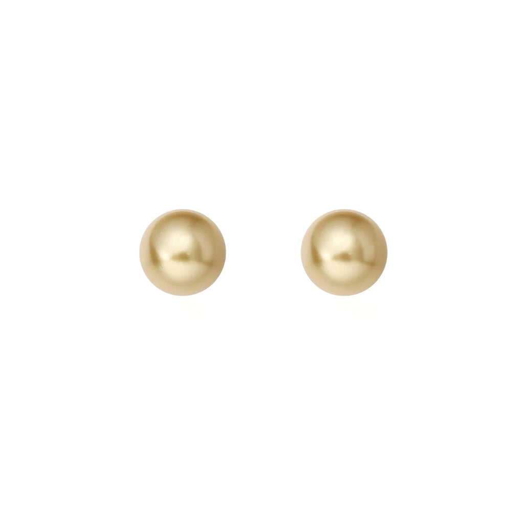 A pair of large pearl stud earrings with a geometric silver setting and an eight-awh star detail on a white background.