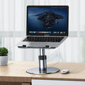 Silver adjustable aluminium car laptop stand extended on a car back seat.