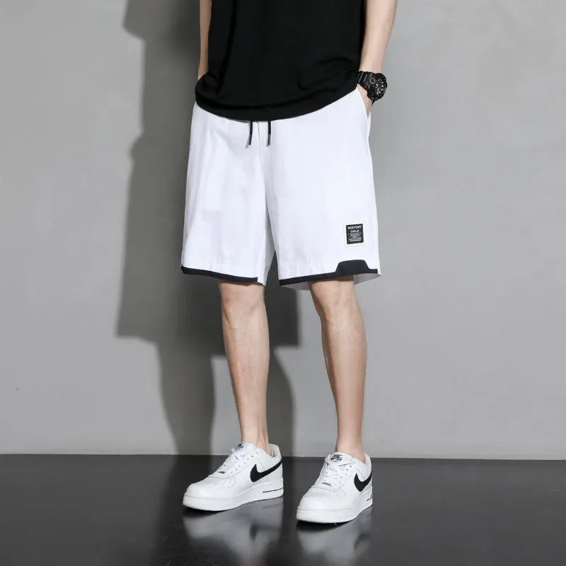 Boys cotton shorts in black, khaki and white colours showing mid waist design and shorts length