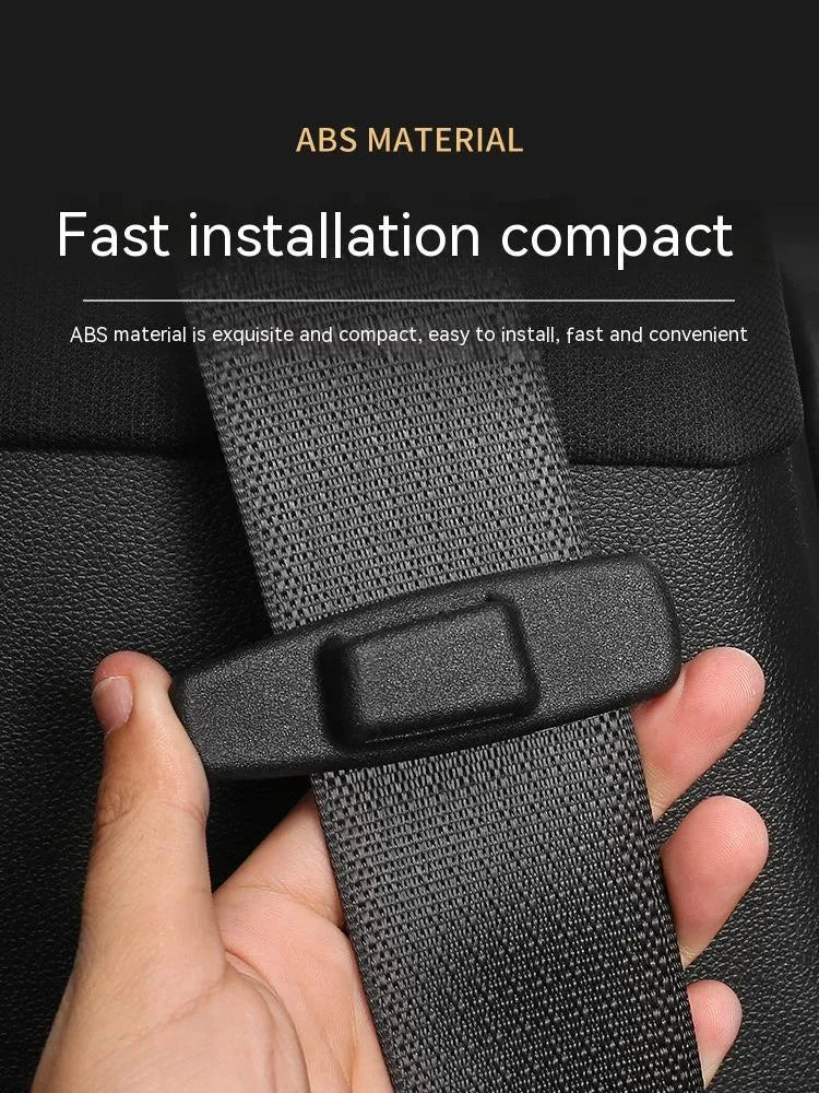 Black ABS plastic car seatbelt stopper clip preventing belt retraction