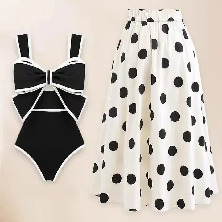 Women's black one-piece swimsuit with white bow and skirt for swimming