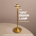Metallic UFO-shaped table lamp in black finish with a touch-sensitive base for dimming.
