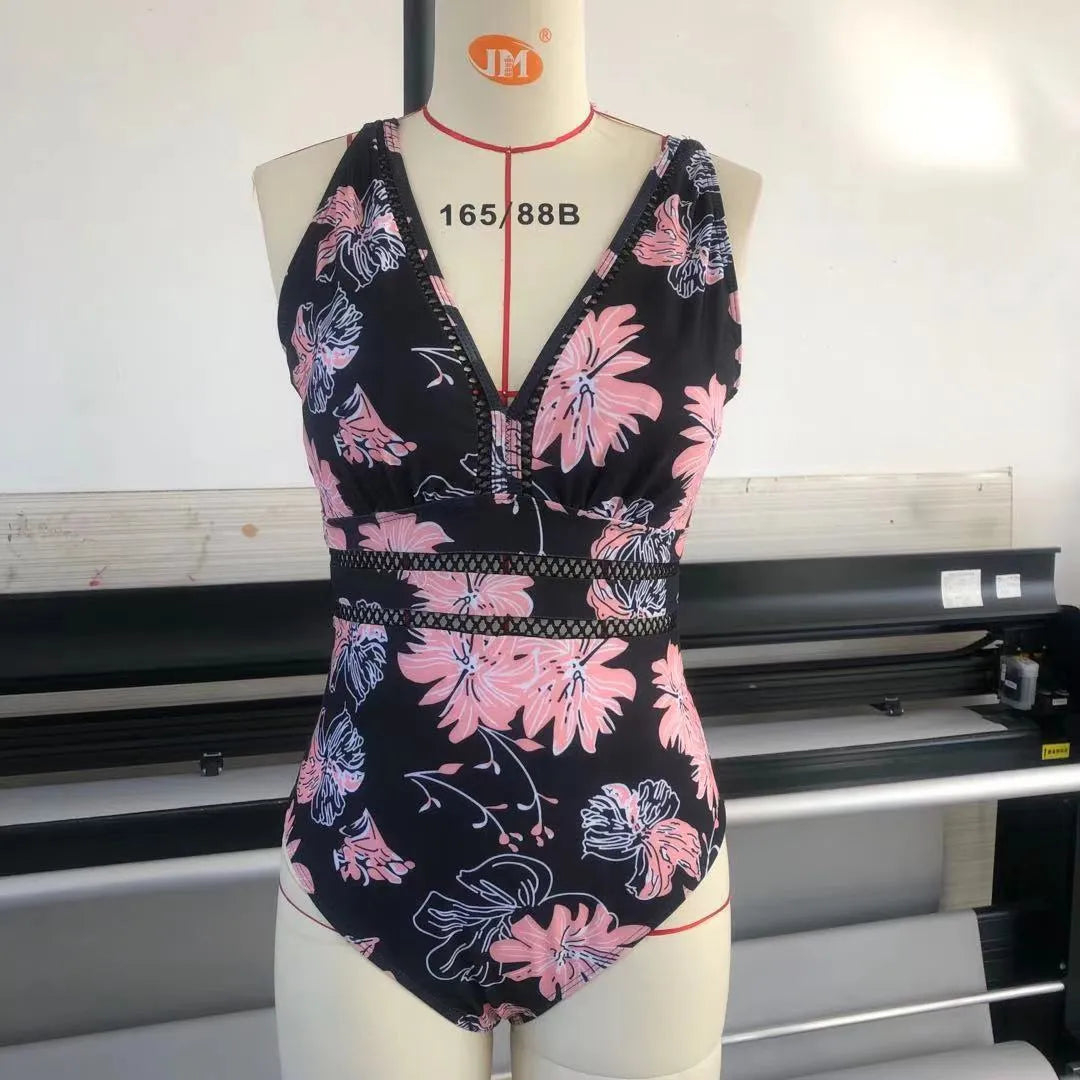 Black printed plus size women's bikini swimsuit on a hanger.
