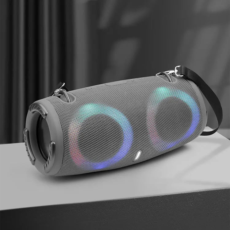 War Drum portable Bluetooth speaker with glowing RGB coloured lights in a camouflage colour variant.