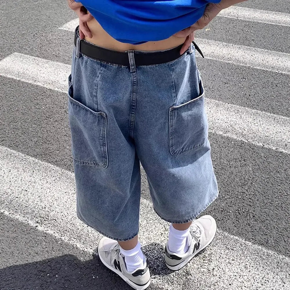 Blue men's cropped high waist denim pirate shorts on a neutral background