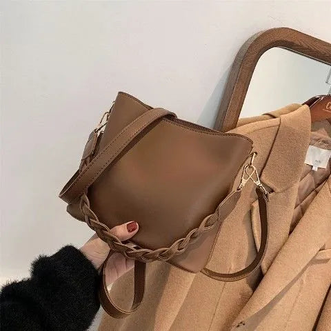 Retro woven PU leather one-shoulder crossbody bucket bag shown in khaki, black, and brown colour options.