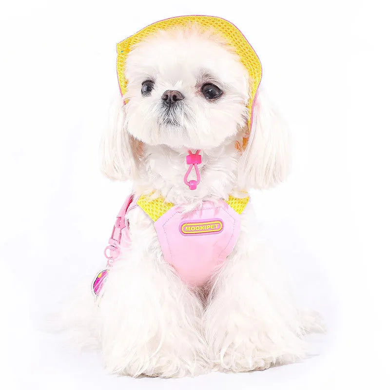 Pink polyester traction vest for a small white dog on a grey background.