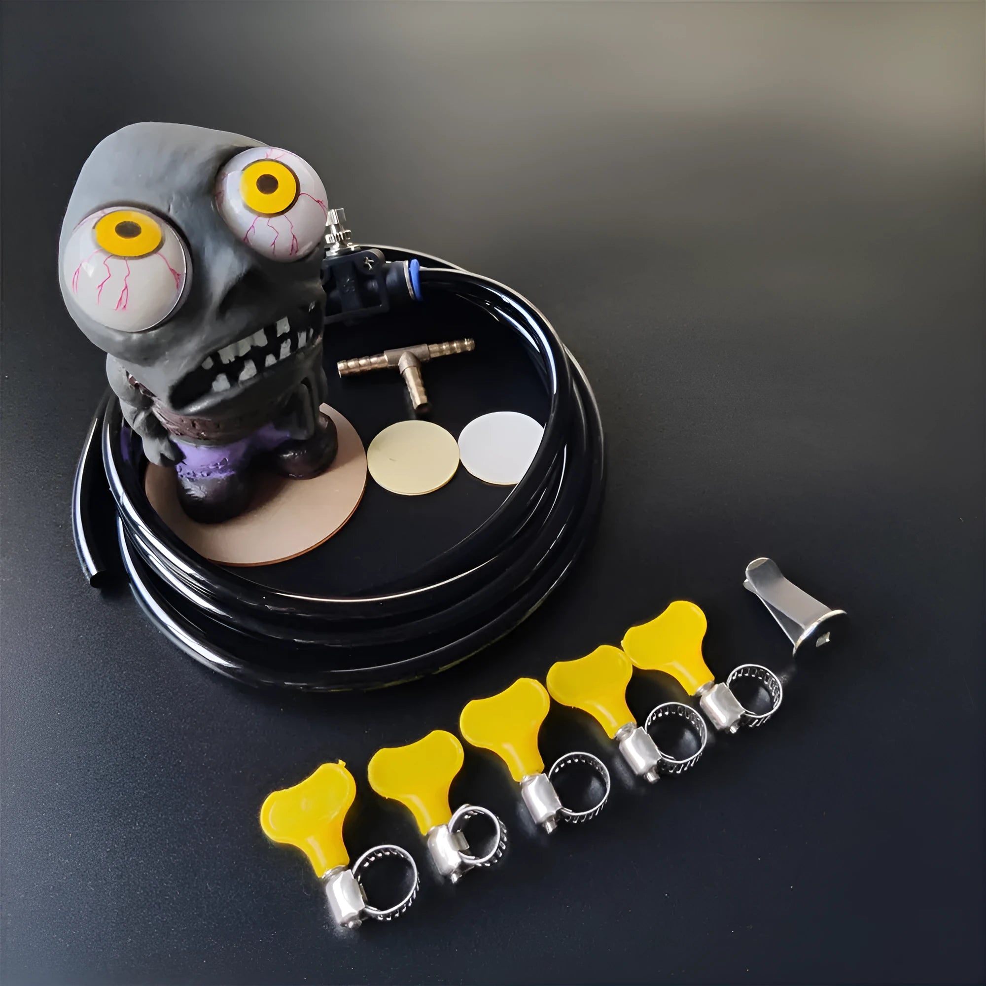 Turbo car blow off valve kit showing rubber doll, pressure regulator valve, copper tube, and clips.