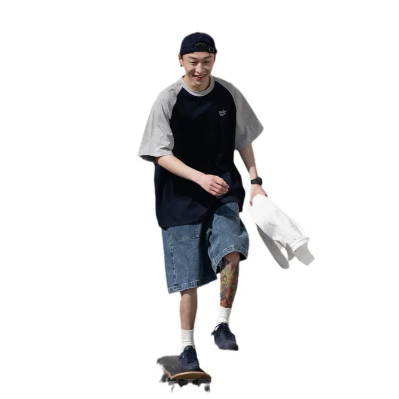 Blue Japanese-style loose men's t-shirt with raglan sleeves on a hanger