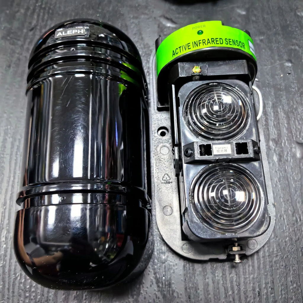 Black 2-beam infrared anti-theft alarm detector for warehouse and perimeter security with 150m range