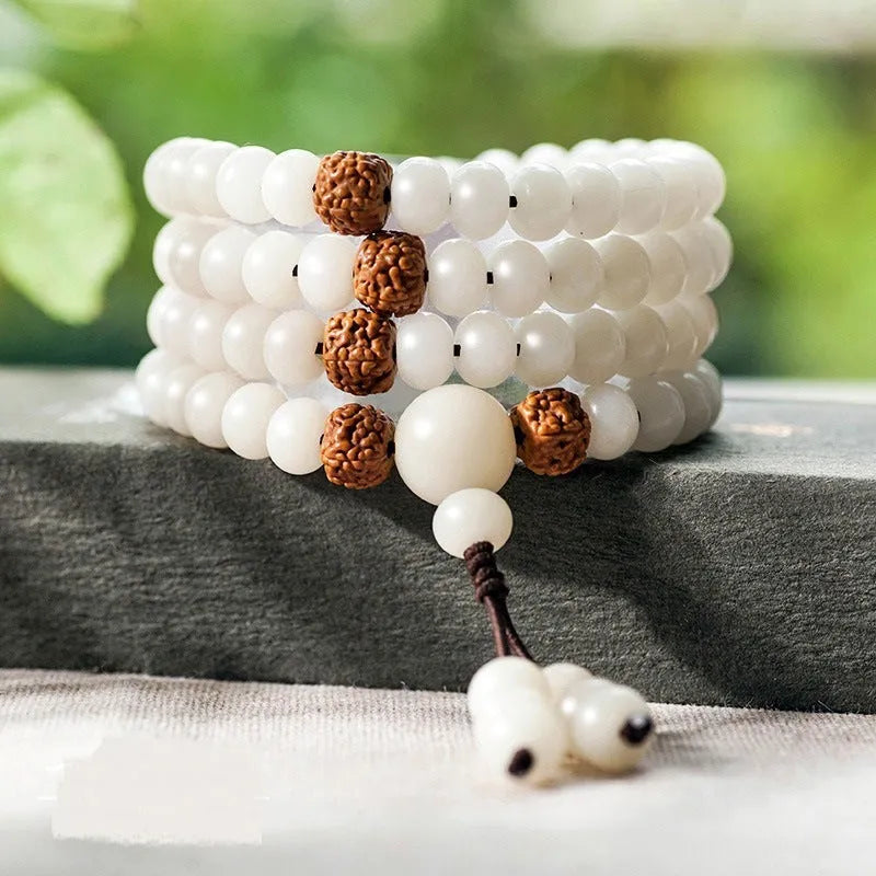 White jade Bodhi bead bracelet with 6x8mm beads in various decorative styles