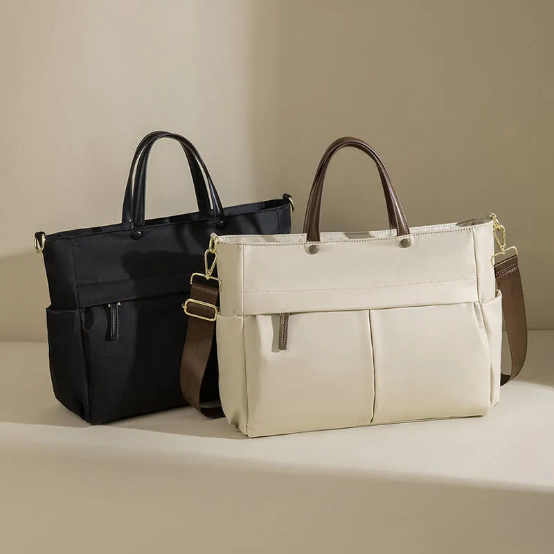 Women's Oxford cloth laptop briefcase in elegant black colour with open pockets and contrast stitching