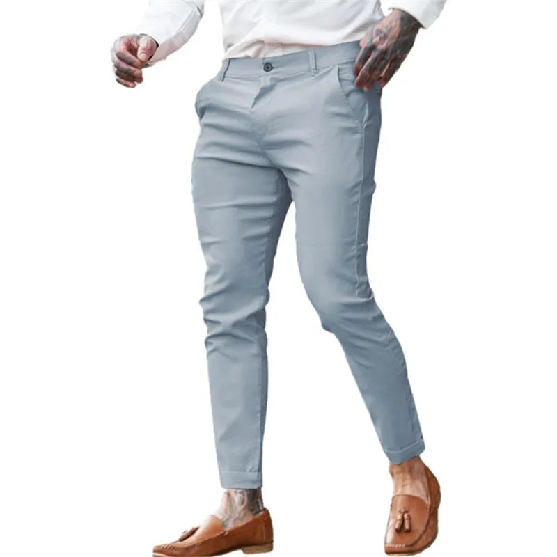 Men's slim fit pencil trousers in cotton twill fabric with stretch, showing zipper fly and mid-waist design