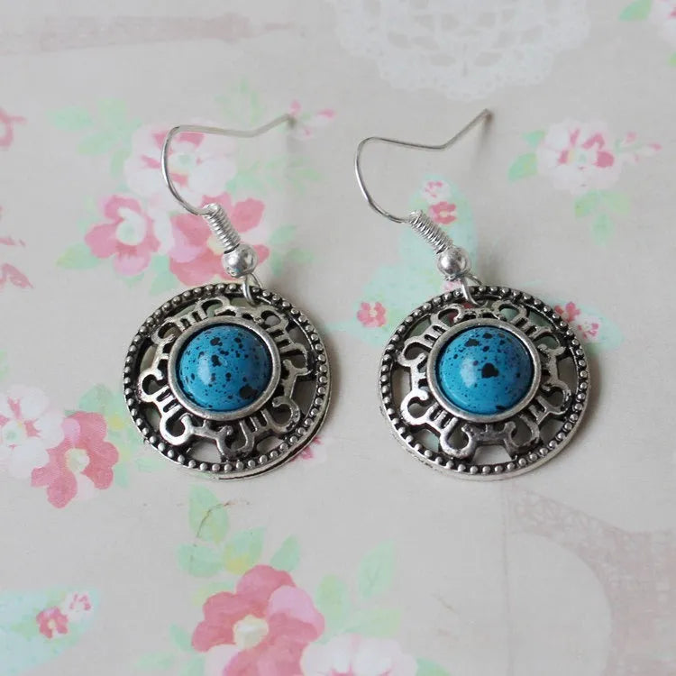 Handmade Miao silver ethnic earrings with geometric turquoise flower disk design