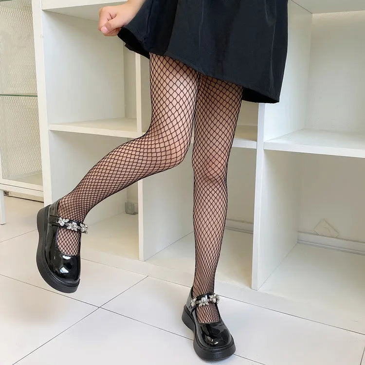 Women's black and white mesh stockings showing large, medium, and small net patterns on a leg.