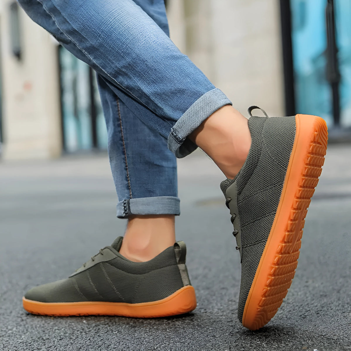 Men's low-top lace-up walking shoes in black with Flyknit upper and round toe on a rubber sole.