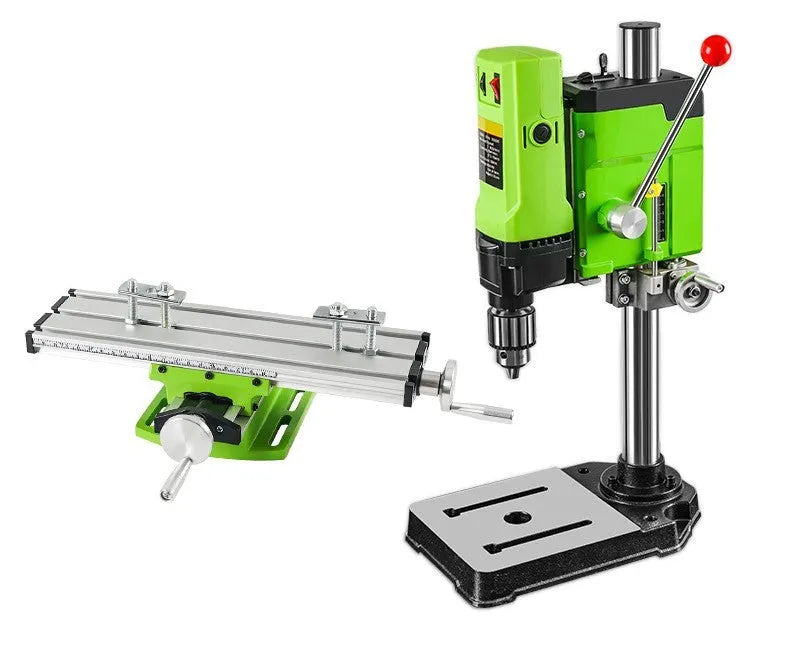 Mini bench drill and milling machine on a workbench with cross bench pliers.