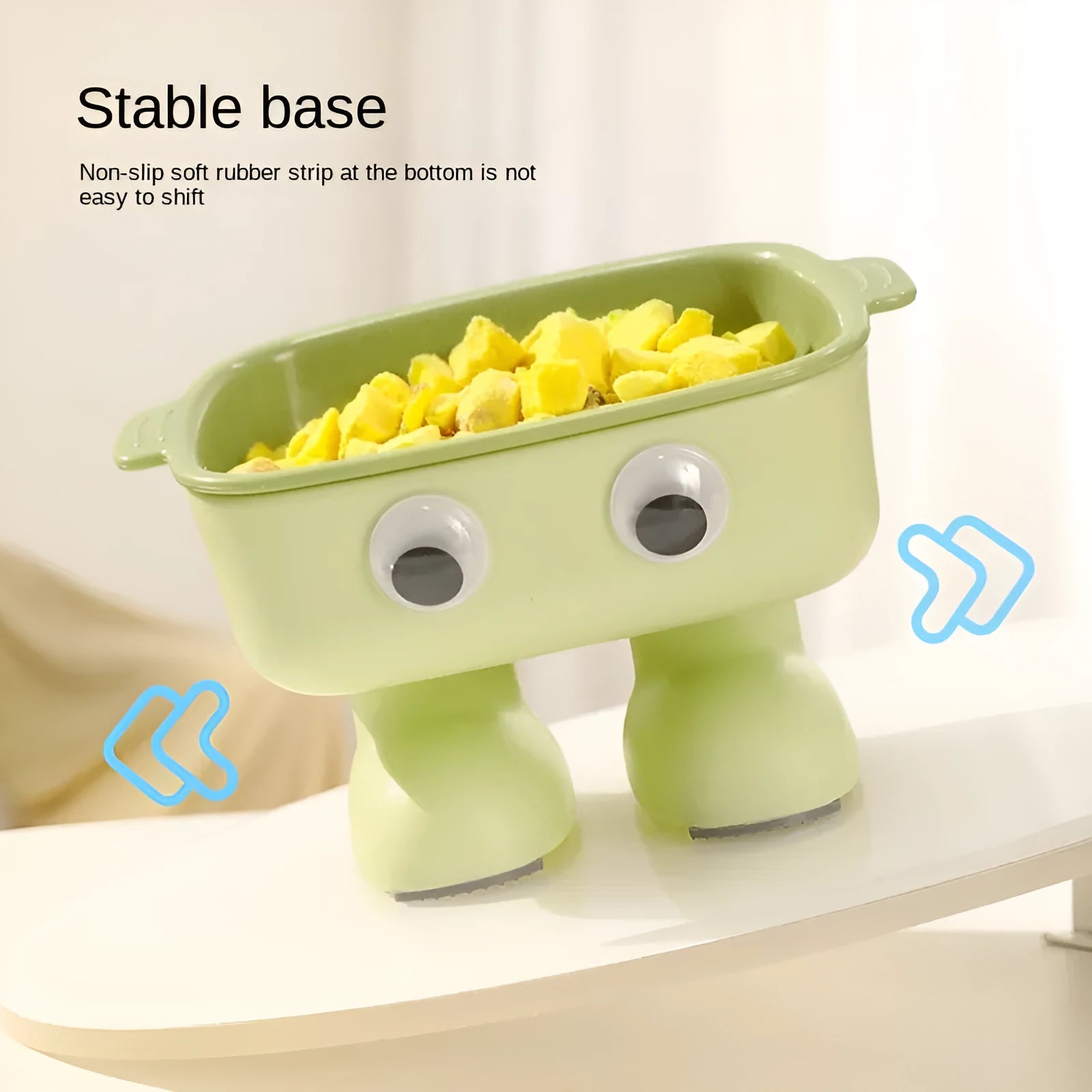 Green cartoon robot shaped elevated cat bowl with tilted food dish on anti-slip base