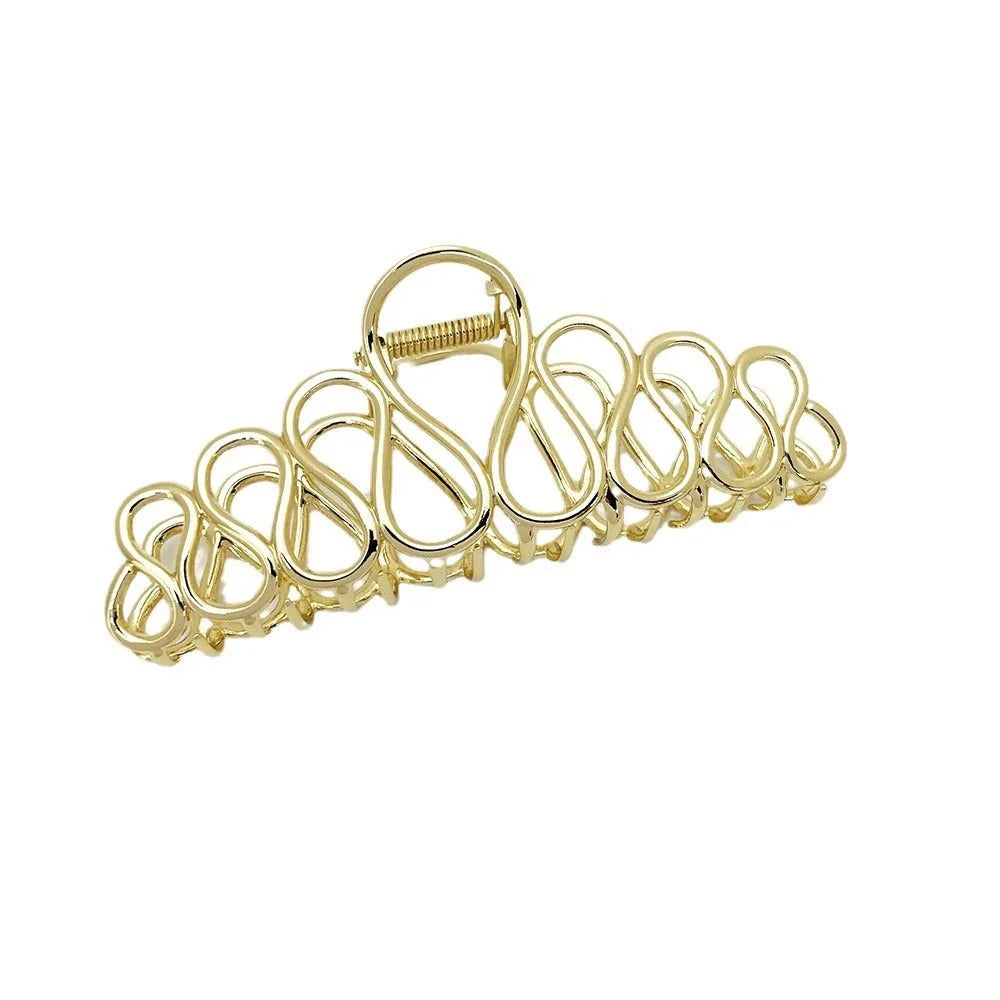 Minimalist large hair clip in gold electroplated alloy with tassel detail for thick hair