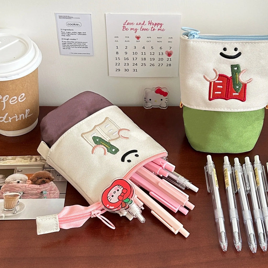 Korean-style Oxford fabric pencil case measuring 17cm by 14cm in brown or green colours