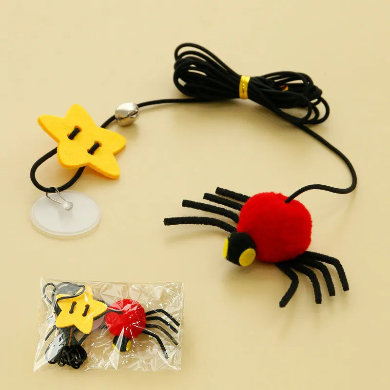 Red and yellow cat hanging door toy with elastic rope, feather, bell, and spider attachment