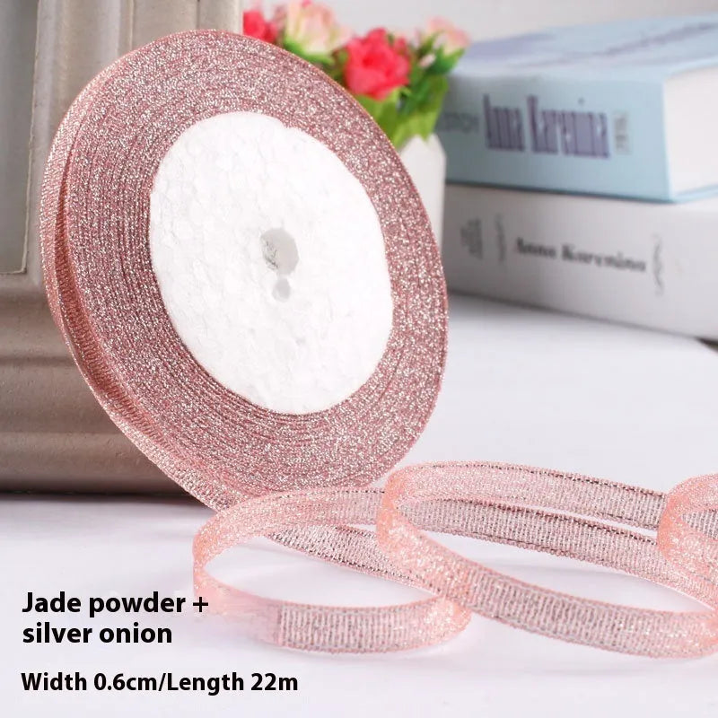 Roll of polyester gift packaging ribbon with 0.6cm width and 22 metre length in various colour options