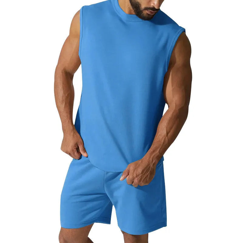 Man wearing a sleeveless army green top and matching shorts from a casual cotton blend sports suit set.