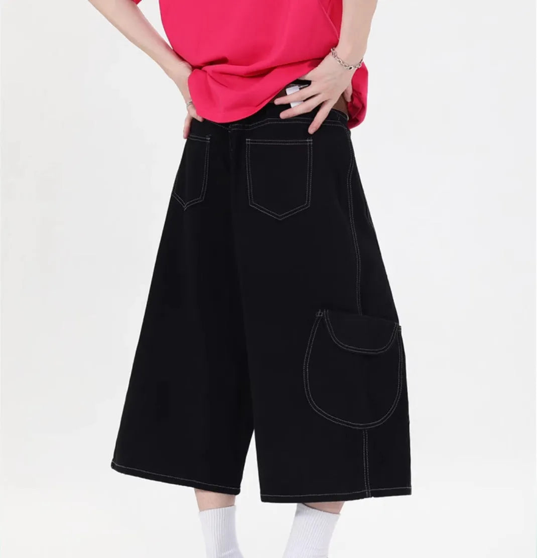 Retro denim workwear shorts with multiple pockets and wide leg cropped design in black colour