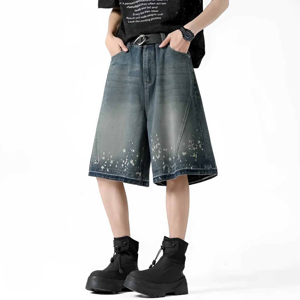 Men's straight cut denim shorts with retro blue wash and ripped splash ink details