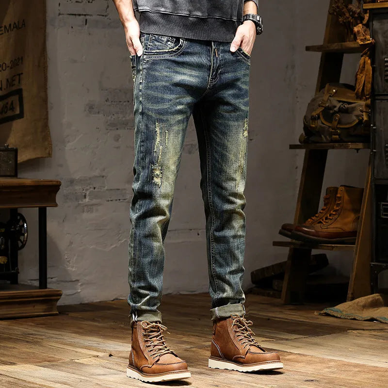 Men's skinny fit jeans in retro blue denim with a zip fly, shown laid flat.