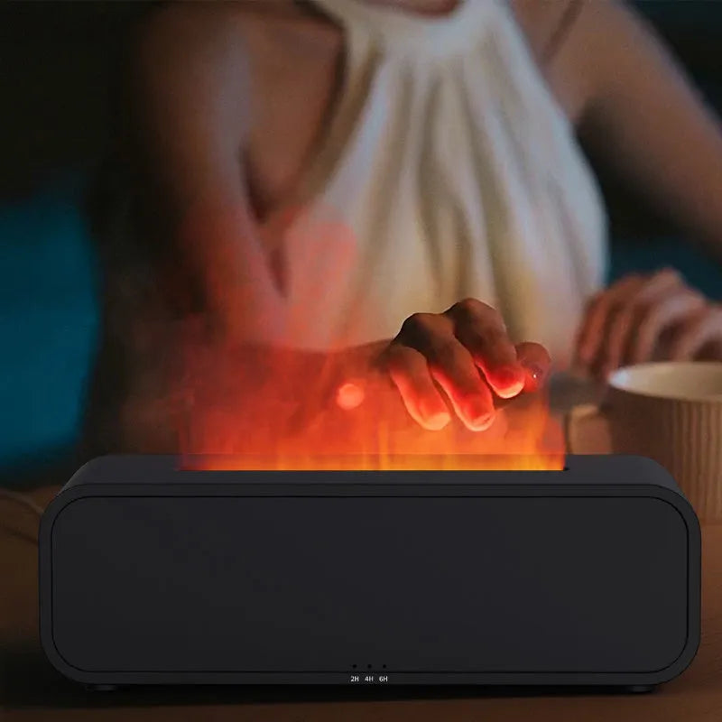 Black aromatherapy diffuser with colour-changing lights and remote control on table