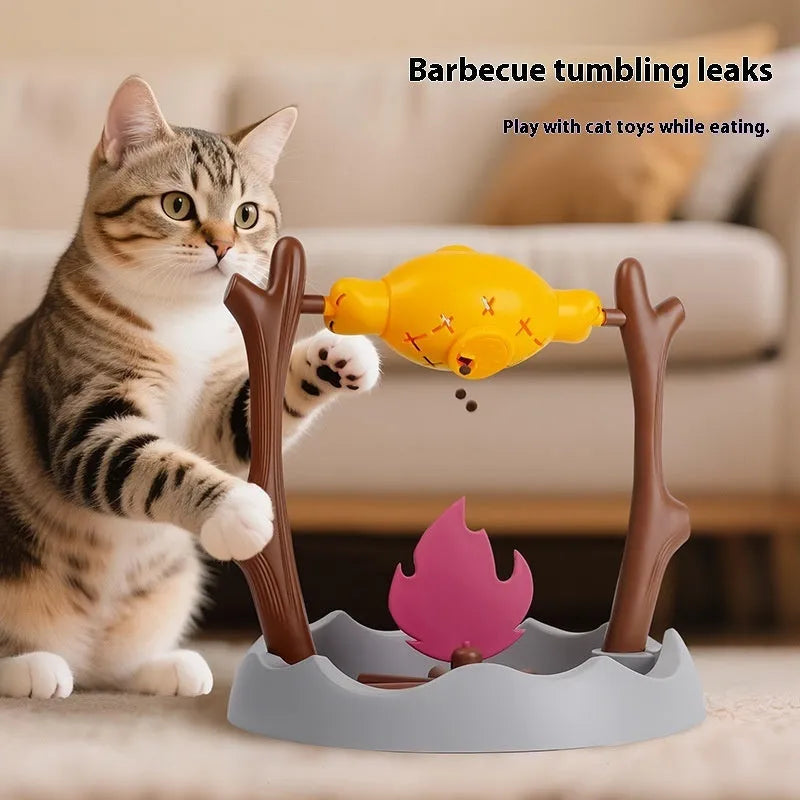 Barbecue style plastic cat toy with tumbling food feeder for treat dispensing.
