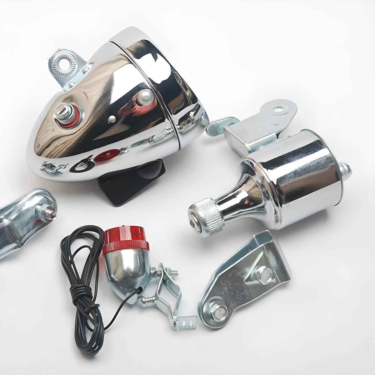 Silver bicycle dynamo-powered light generator kit for front fork or rear frame mounting.