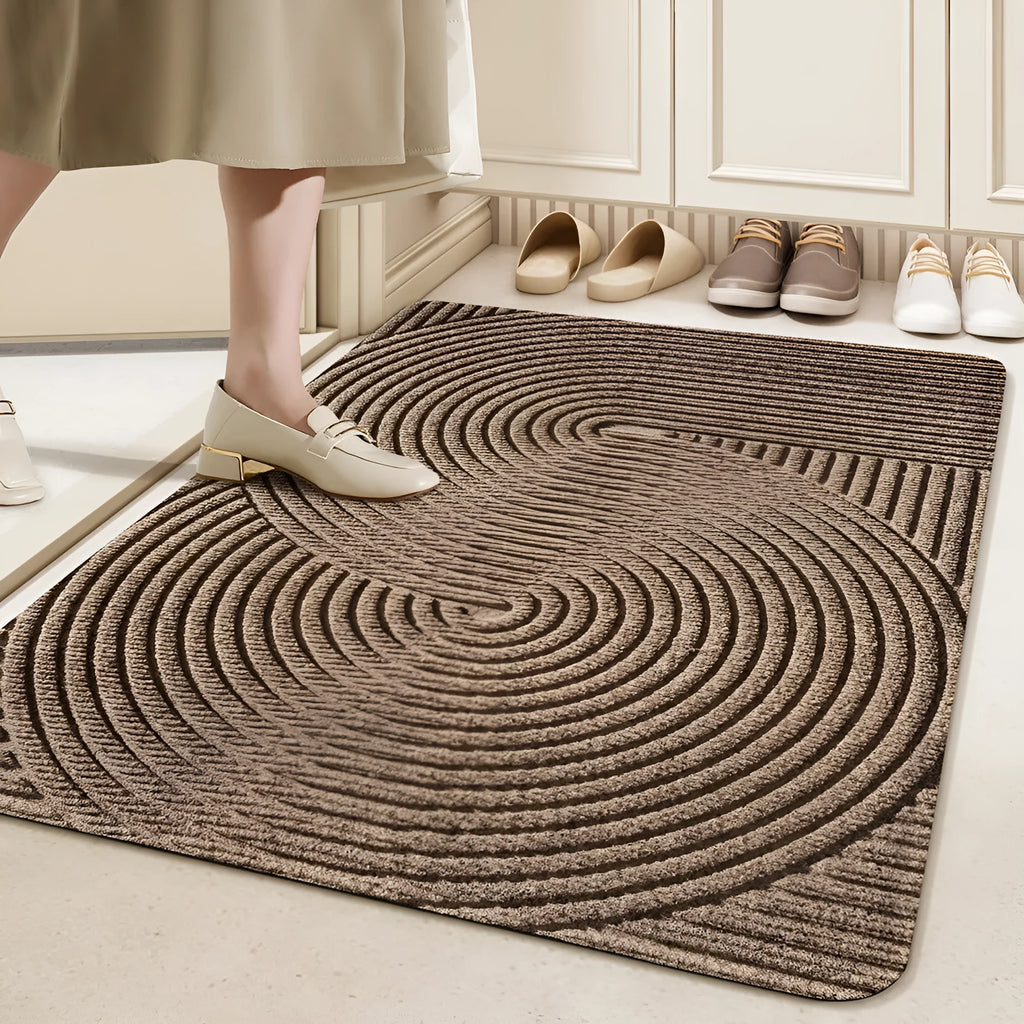 Green diatom earth entrance floor mat with alien shape, wire ring border, and cartoon anime pattern.