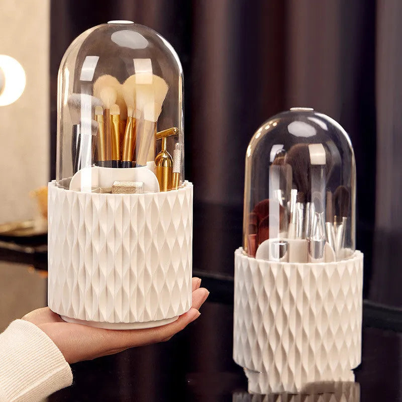 White rotating transparent makeup brush storage organiser with dust cover on desktop