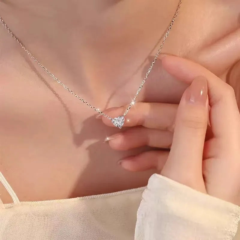 Women's silver heart necklace with minimalist copper pendant on chain