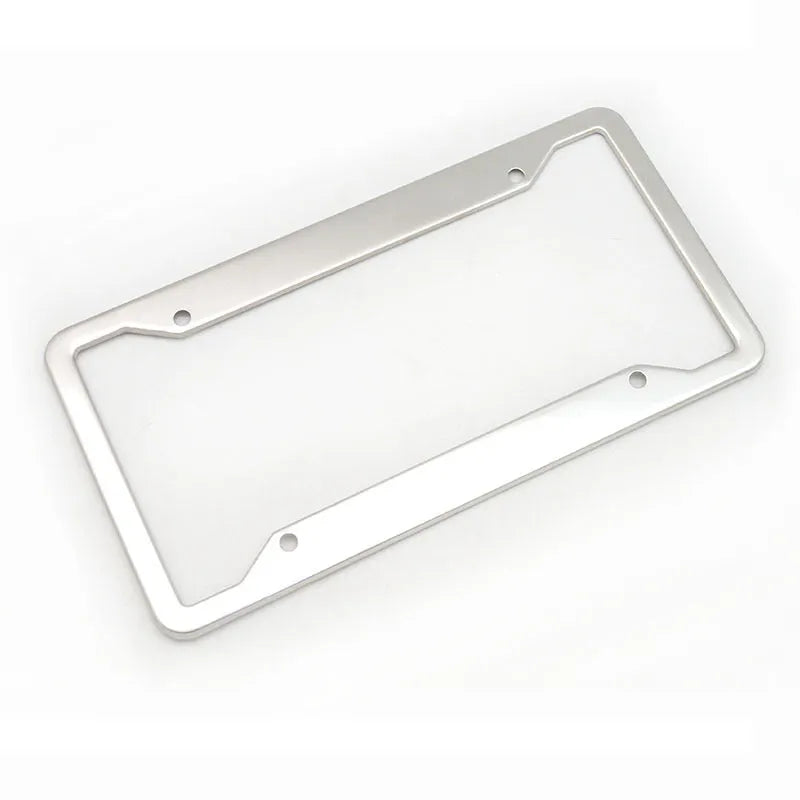 Aluminium alloy license plate frame in choice of four finishes next to a car registration plate.