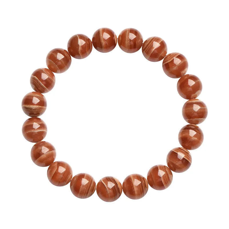 Natural Old Mine Rhodochrosite round bead bracelet from Peru showing pinkish-red mineral colour