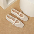 Women's beige mesh breathable pumps with a buckle fastening and square toe.
