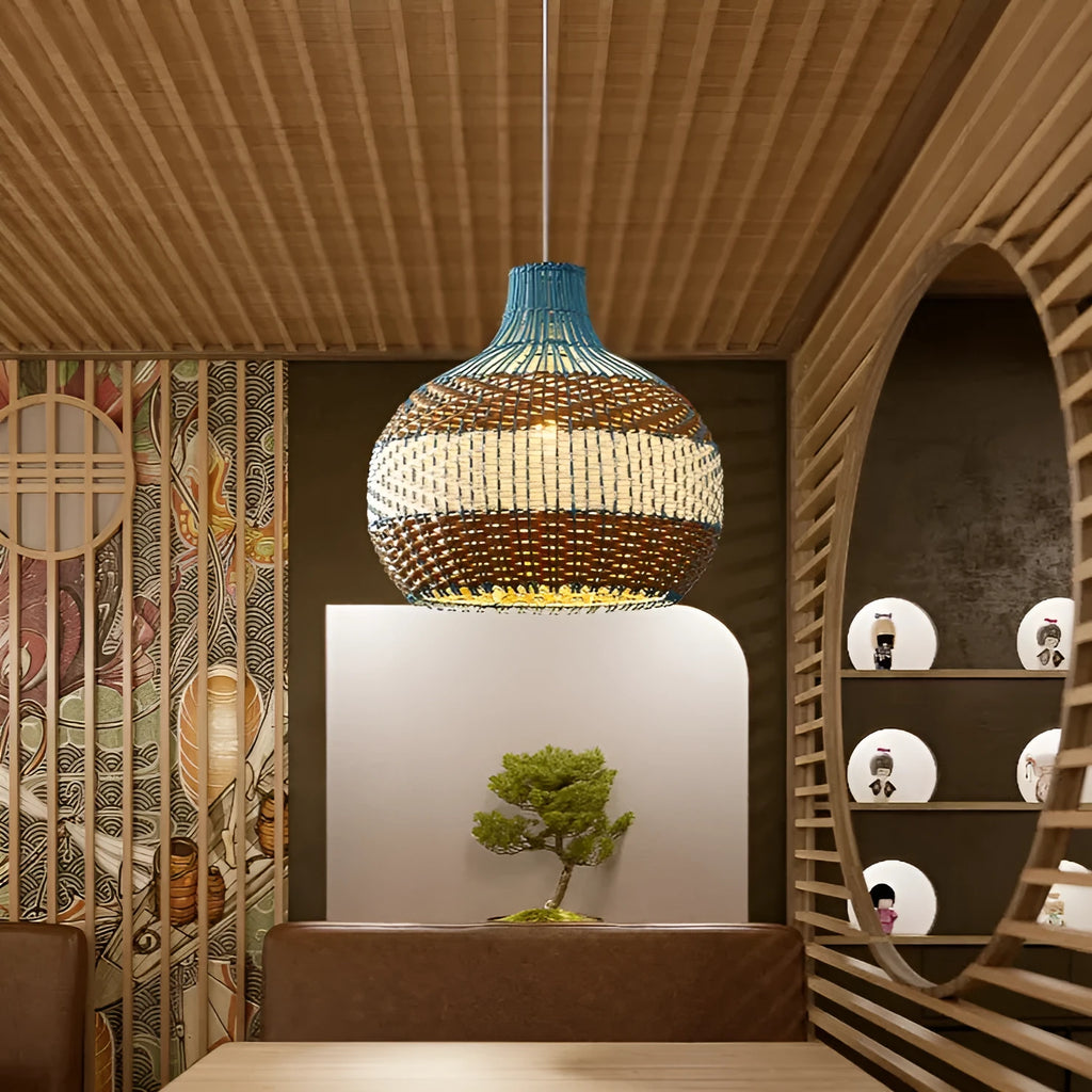 Vine woven Southeast Asian style pendant lamp with natural material construction in pastoral tea room design