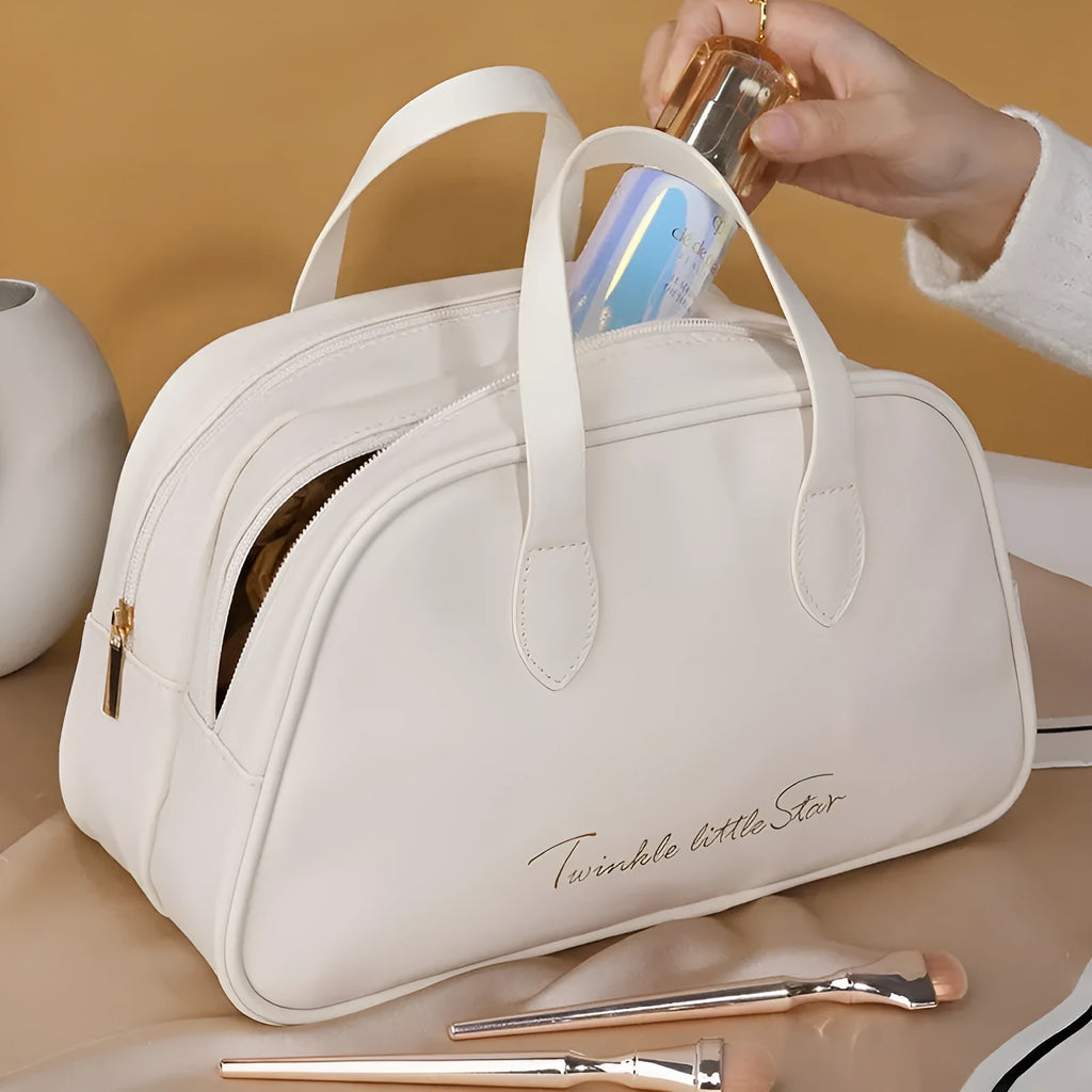 Leather travel toiletry bag open, showing interior compartments and dry-wet separation, in caramel mocha colour.