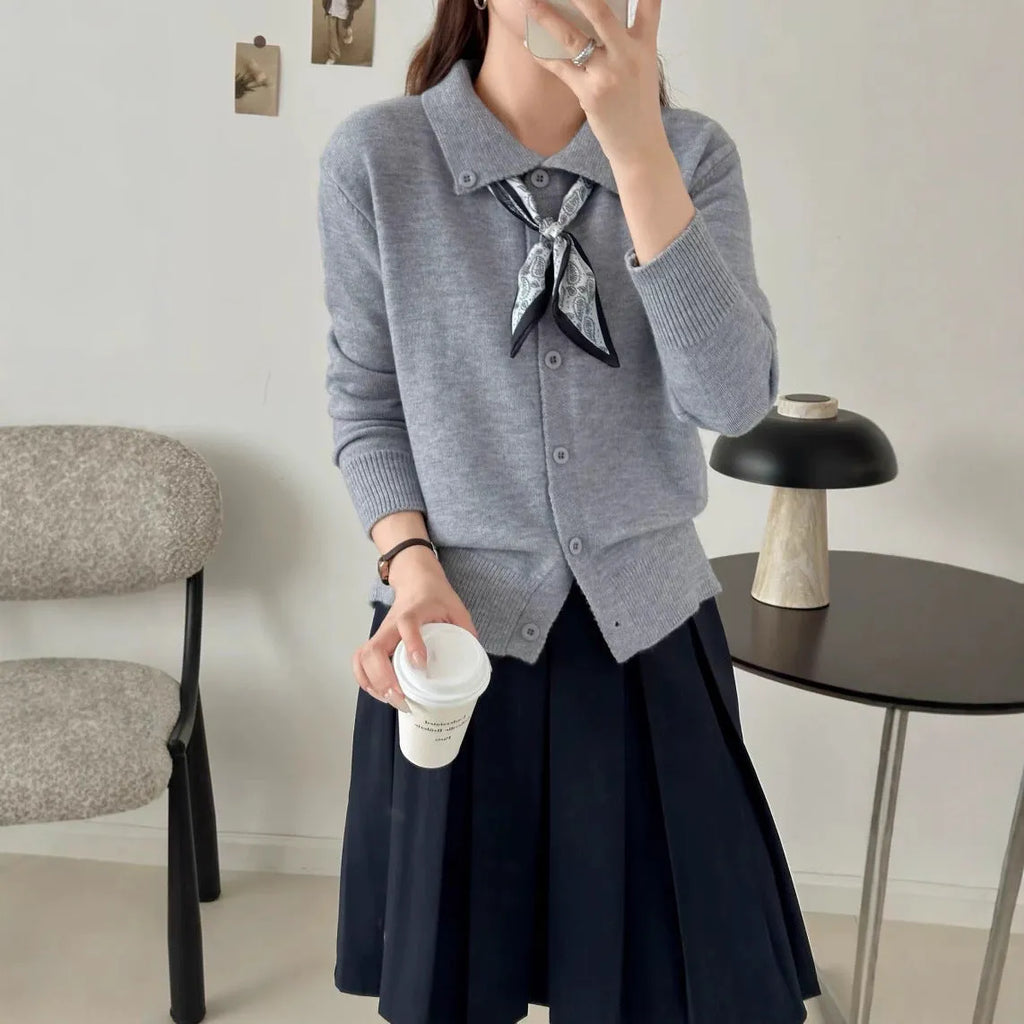 Women's grey lapel scarf cardigan sweater with colour-block panels and long sleeves.