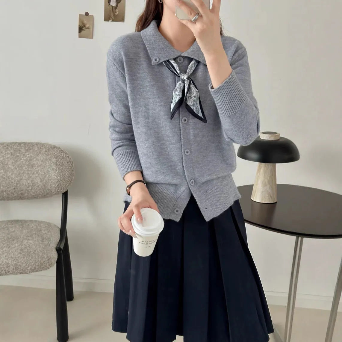 Women's grey lapel scarf cardigan sweater with colour-block panels and long sleeves.