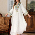 White Arabic robe for women with long sleeves and a floor-length skirt.