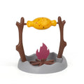 Barbecue style plastic cat toy with tumbling food feeder for treat dispensing.