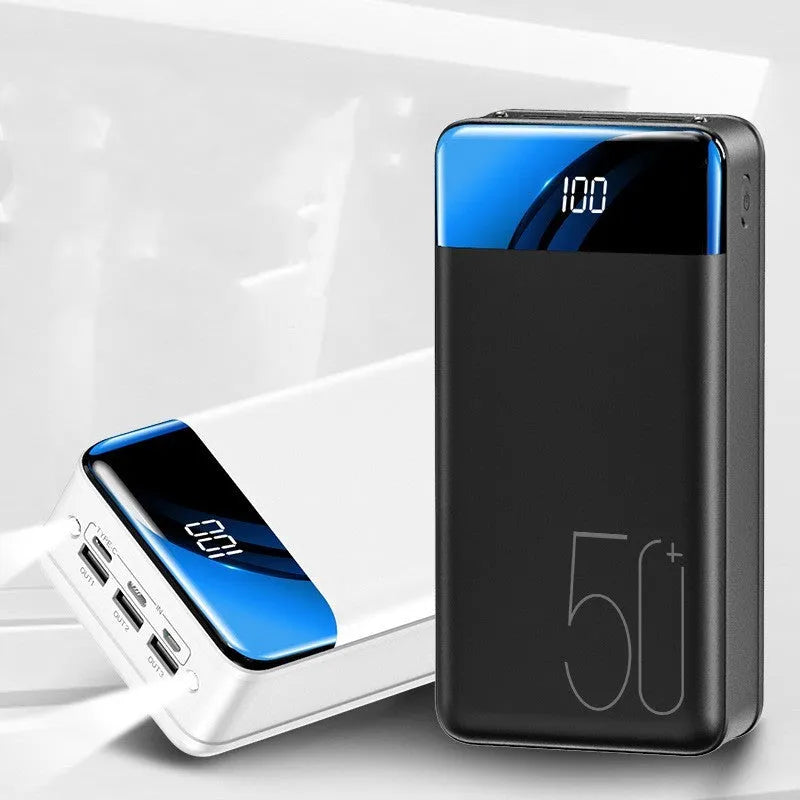 Large 50000 mAh capacity power bank with three USB ports showing black or white colour options