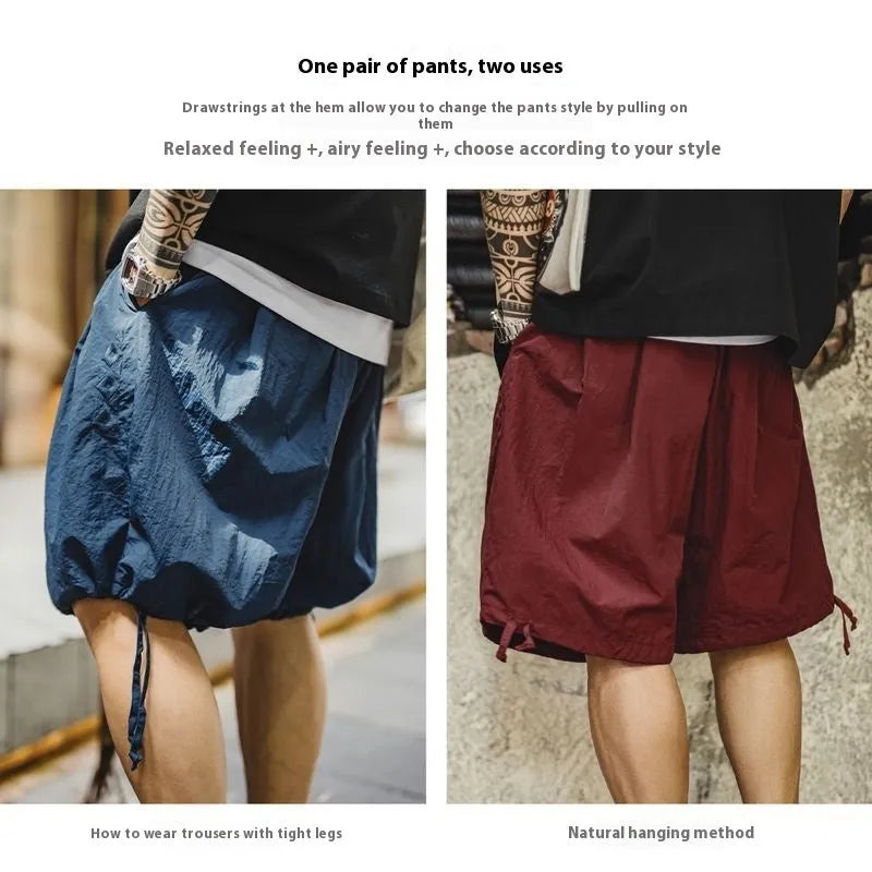 Men's loose Prussian Blue nylon beach shorts with embroidered detail and straight cut