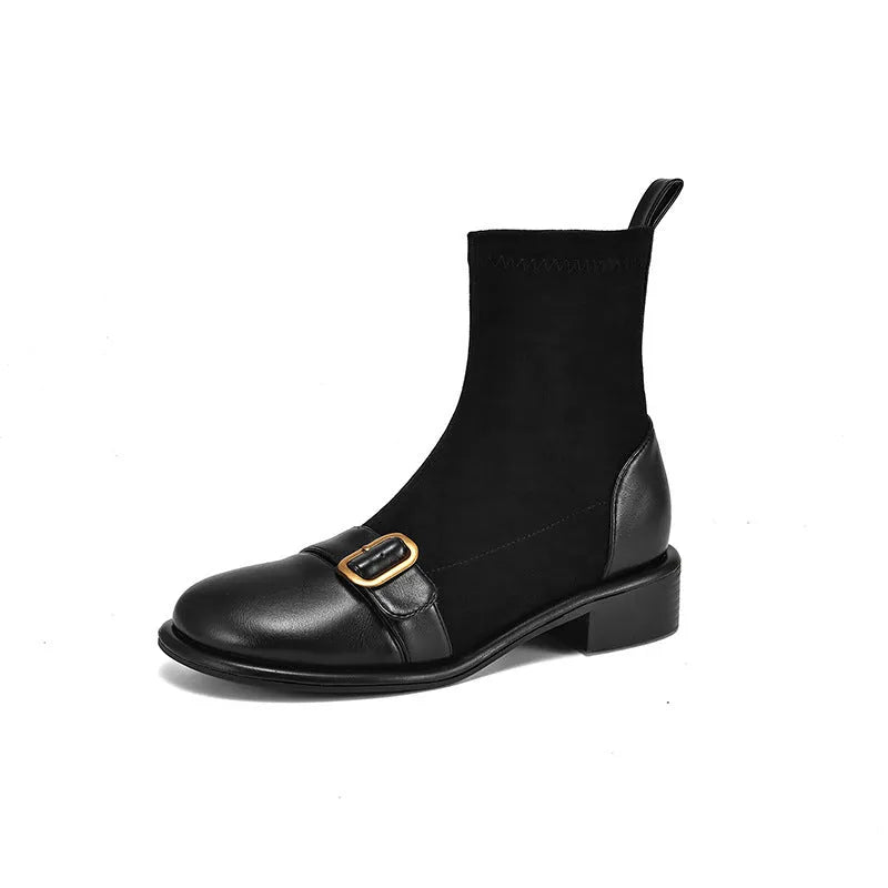 Women's black low heel Martin boots with front lace-up and buckle stitch detail on a round toe.